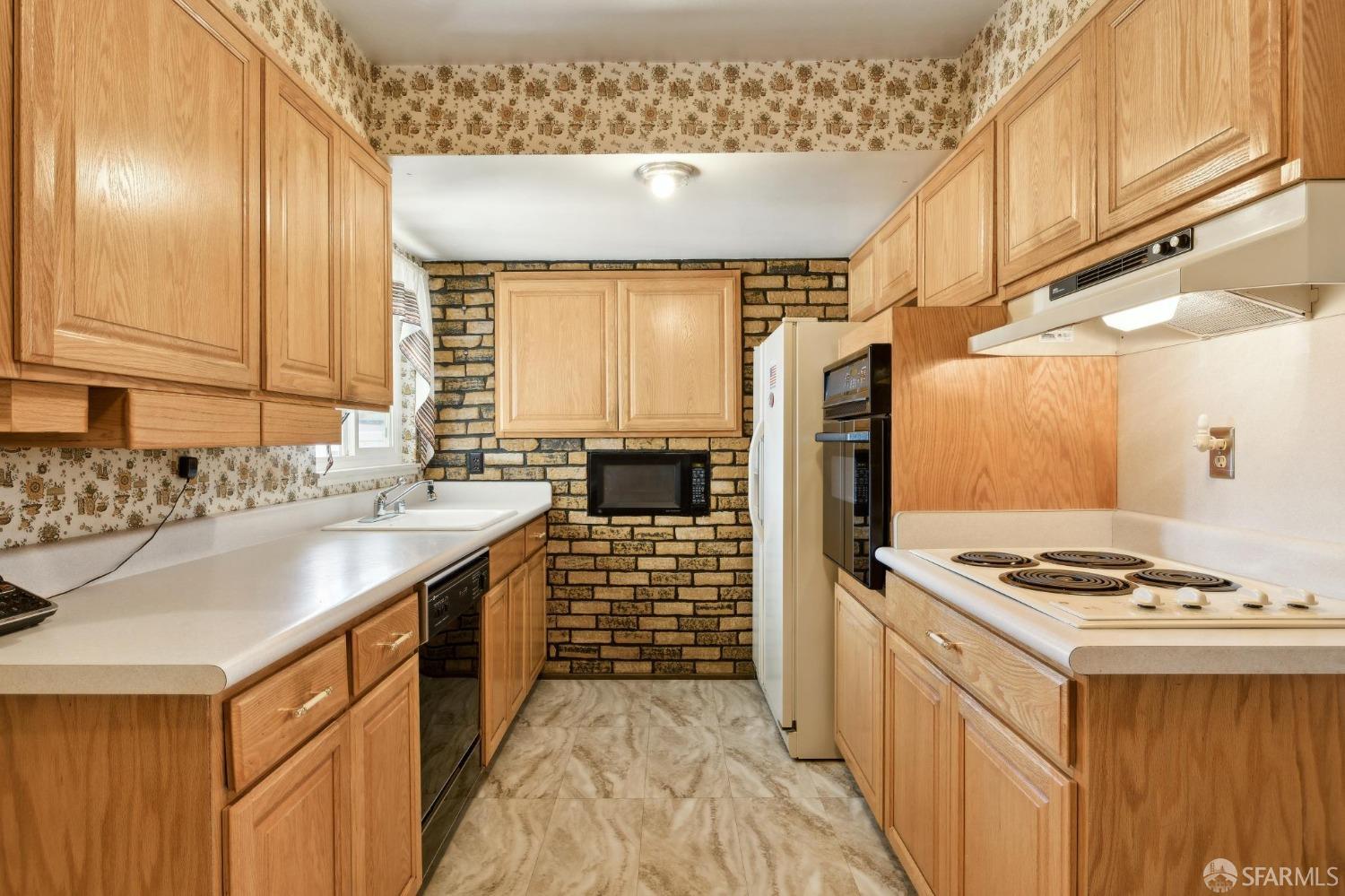 2521 Sherwood Drive San Bruno, CA 94066 - Photo 16 of 39 a kitchen with sink cabinets and stove