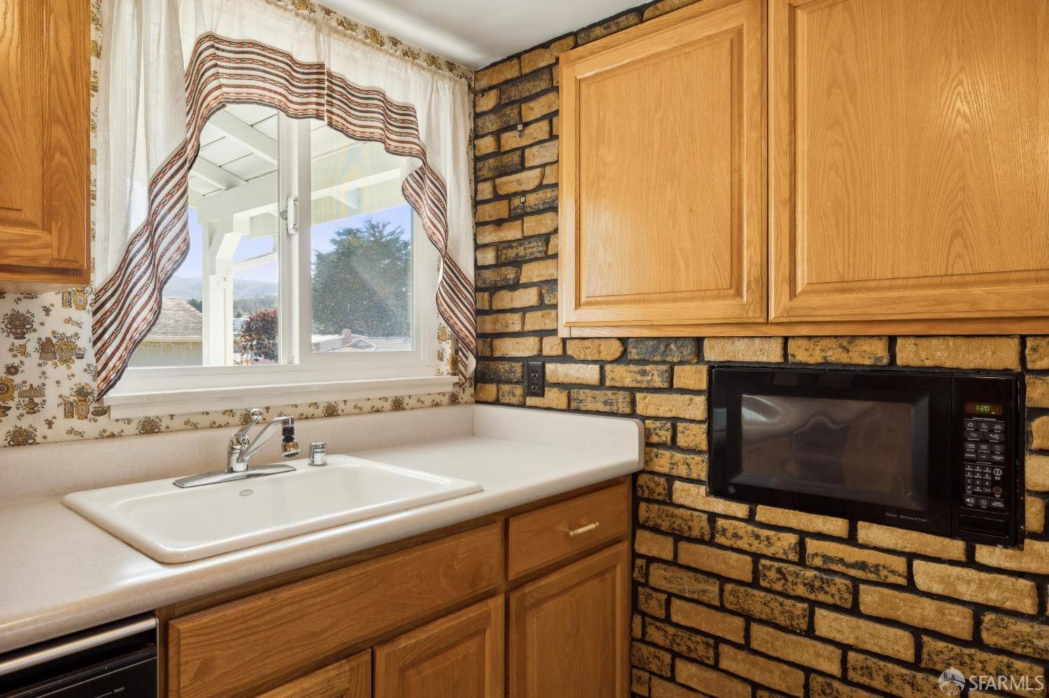 2521 Sherwood Drive San Bruno, CA 94066 - Photo 17 of 39 a bathroom with a sink a mirror and a shower curtain