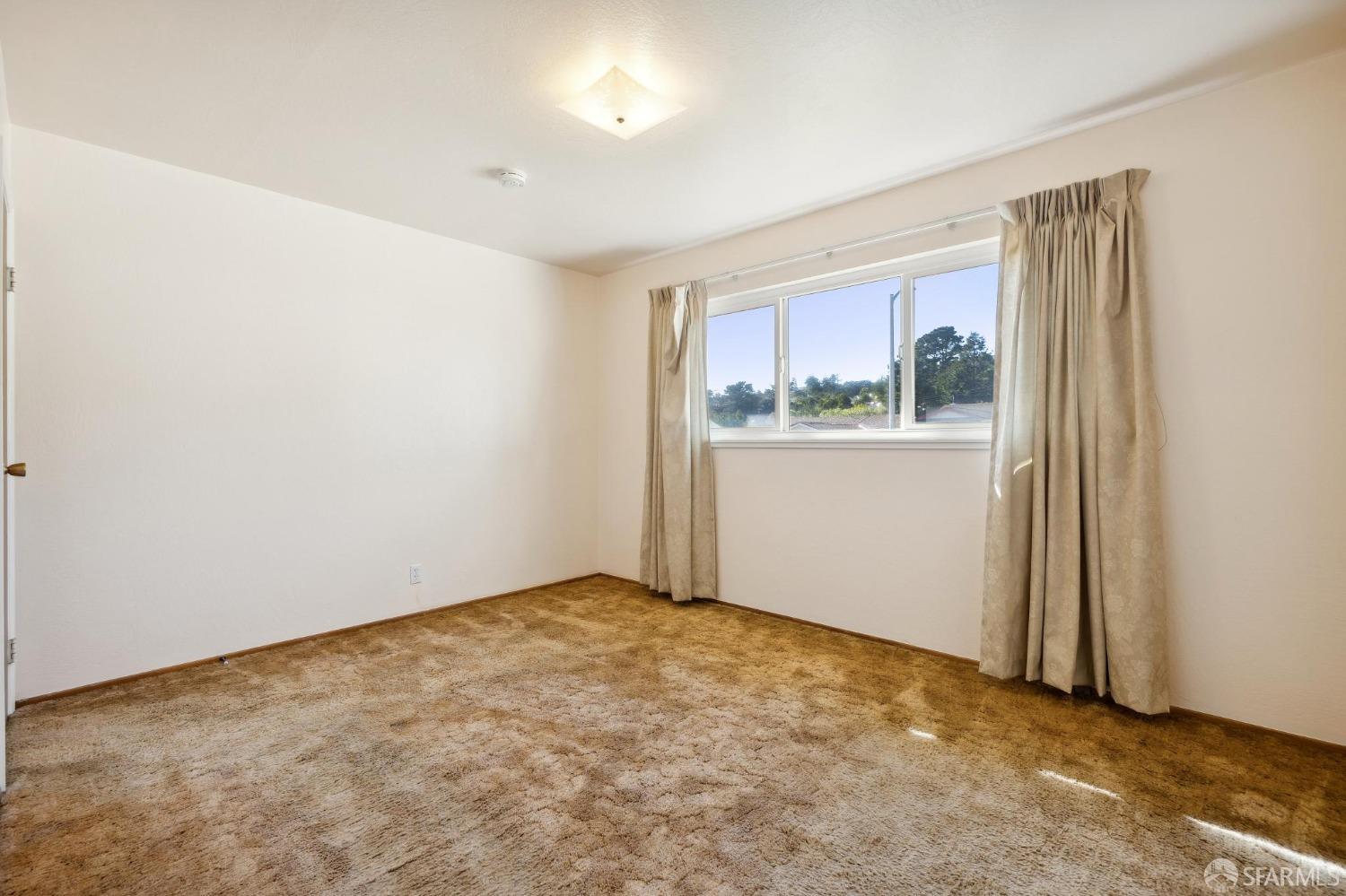 2521 Sherwood Drive San Bruno, CA 94066 - Photo 20 of 39 an empty room with windows