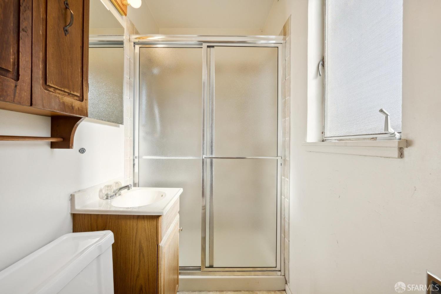 2521 Sherwood Drive San Bruno, CA 94066 - Photo 21 of 39 a bathroom with a shower and a sink