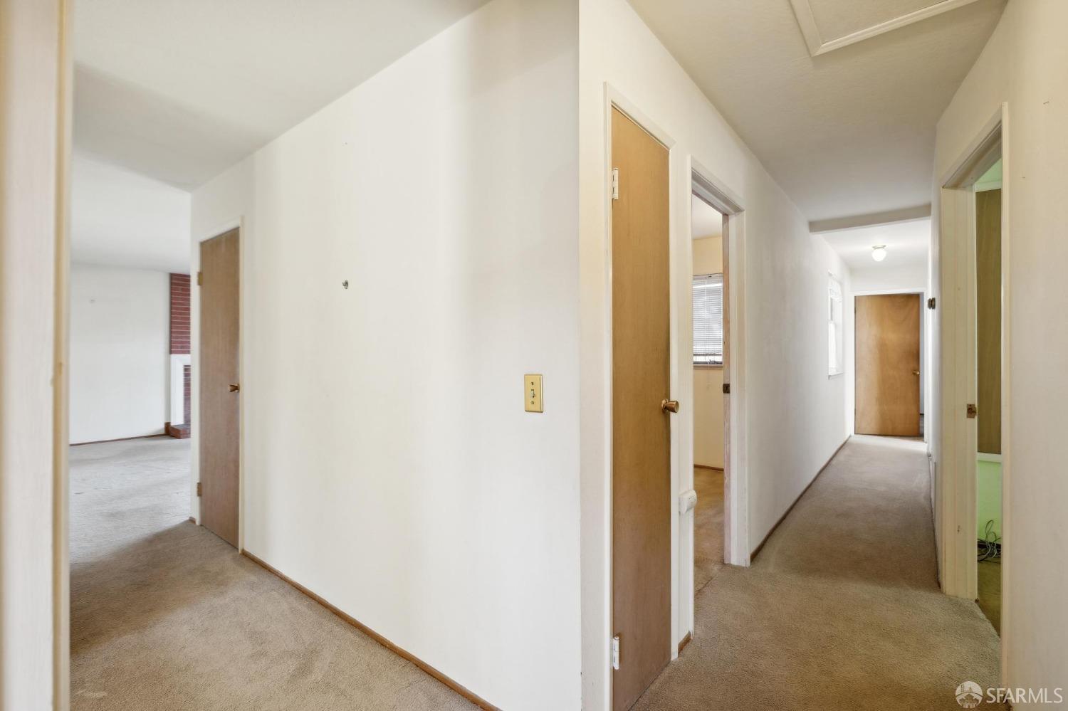 2521 Sherwood Drive San Bruno, CA 94066 - Photo 23 of 39 a view of a hallway with wooden shelves