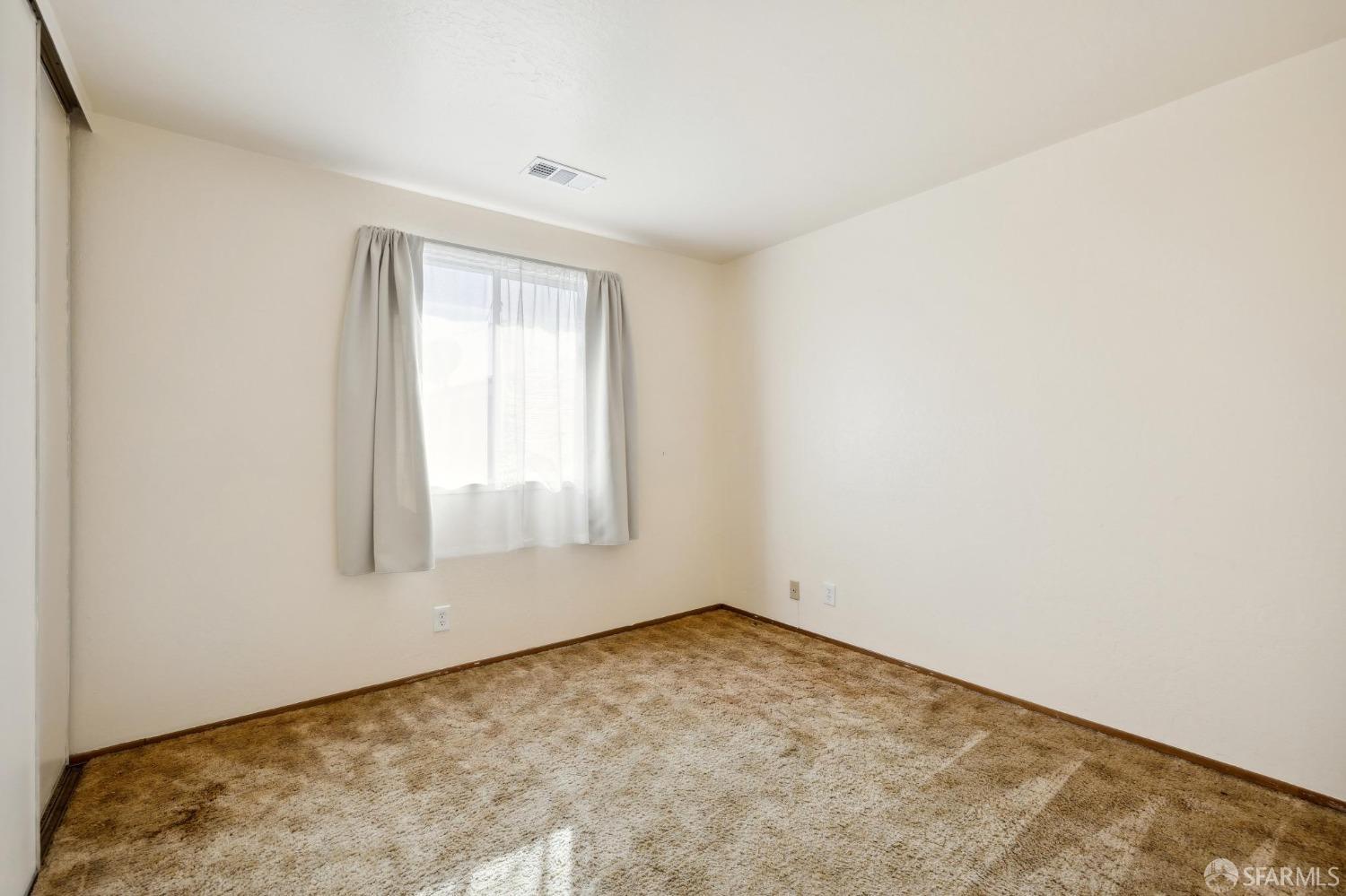 2521 Sherwood Drive San Bruno, CA 94066 - Photo 30 of 39 an empty room with a window