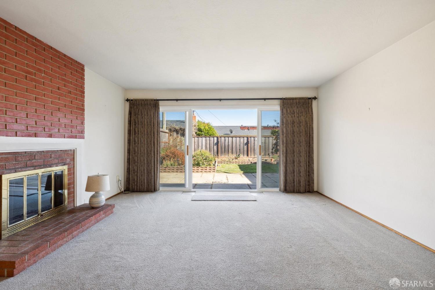 2521 Sherwood Drive San Bruno, CA 94066 - Photo 7 of 39 a view of an empty room with a fireplace