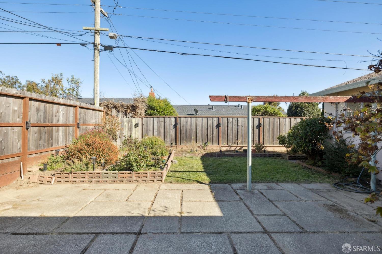 2521 Sherwood Drive San Bruno, CA 94066 - Photo 9 of 39 a view of a backyard with brick wall and potted plants