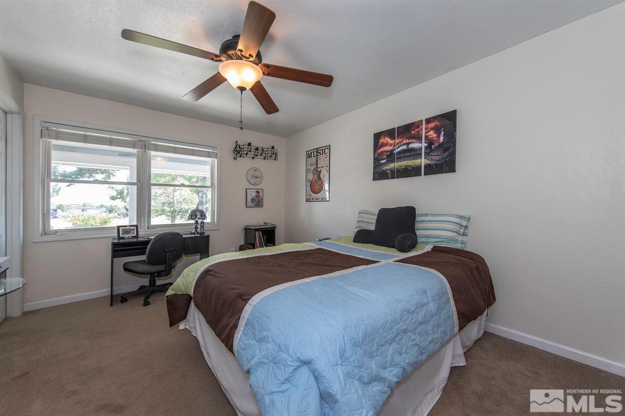 10785 Santa Fe Road Reno, NV 89508 - Photo 13 of 25 a bedroom with a bed and a window