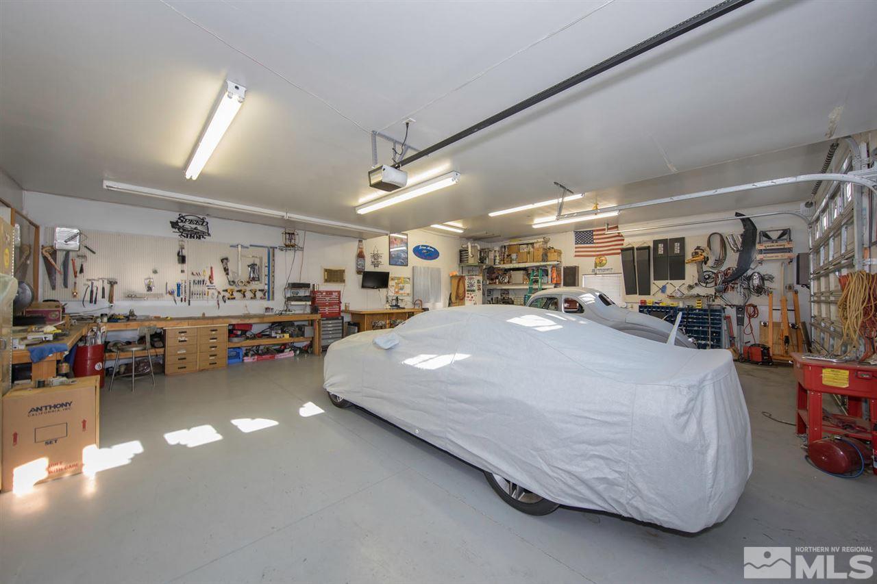 10785 Santa Fe Road Reno, NV 89508 - Photo 16 of 25 a bed room with lots of furniture and clutter
