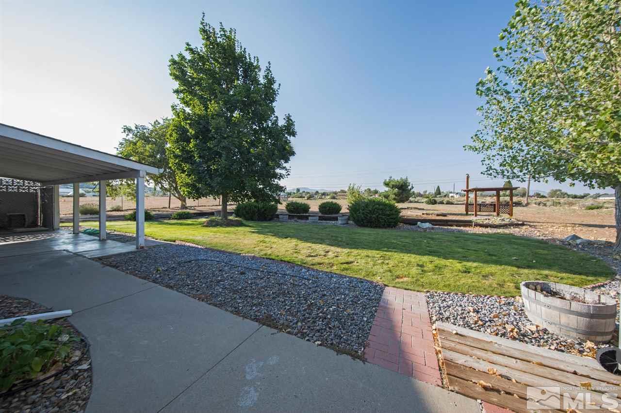 10785 Santa Fe Road Reno, NV 89508 - Photo 20 of 25 a view of a swimming pool and a yard