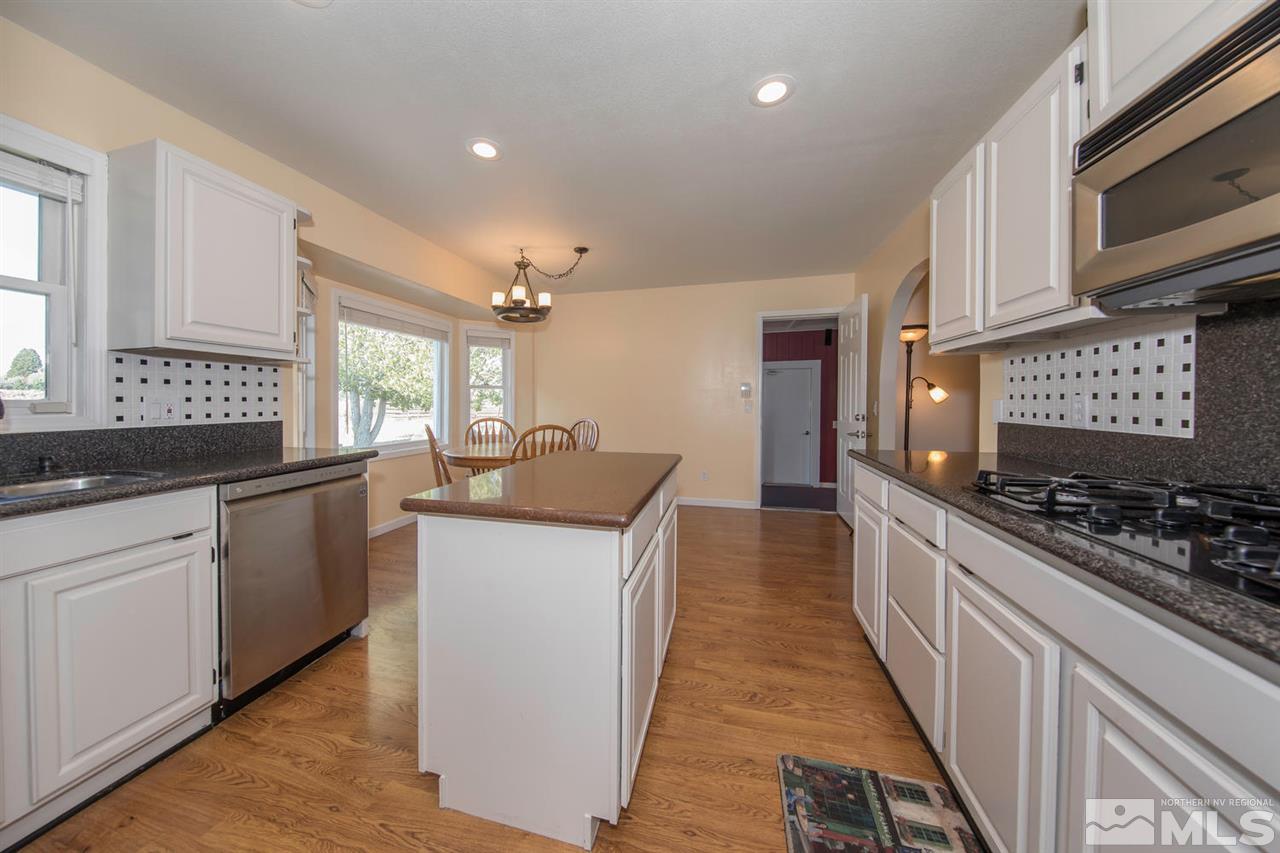 10785 Santa Fe Road Reno, NV 89508 - Photo 6 of 25 a kitchen with stainless steel appliances granite countertop a stove and a sink