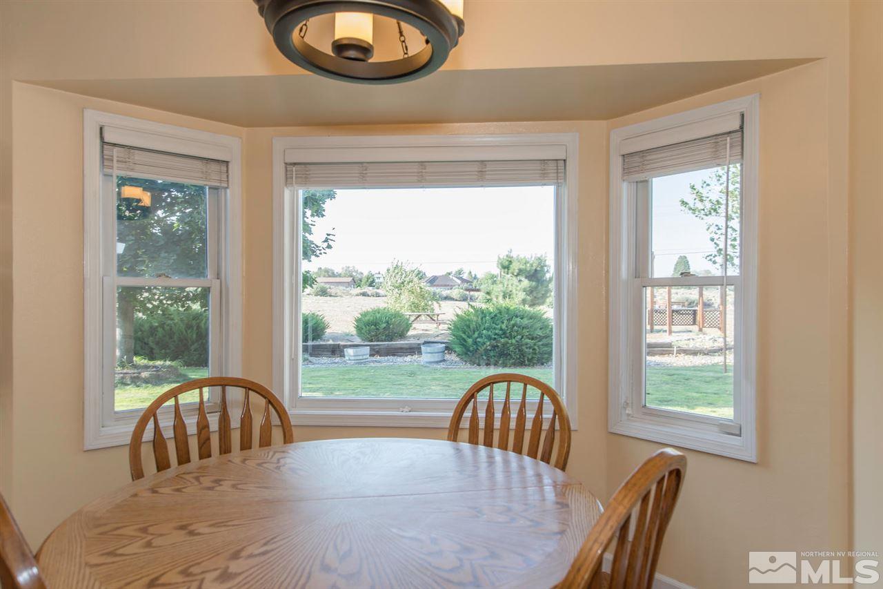 10785 Santa Fe Road Reno, NV 89508 - Photo 7 of 25 a view of a city from a dining room