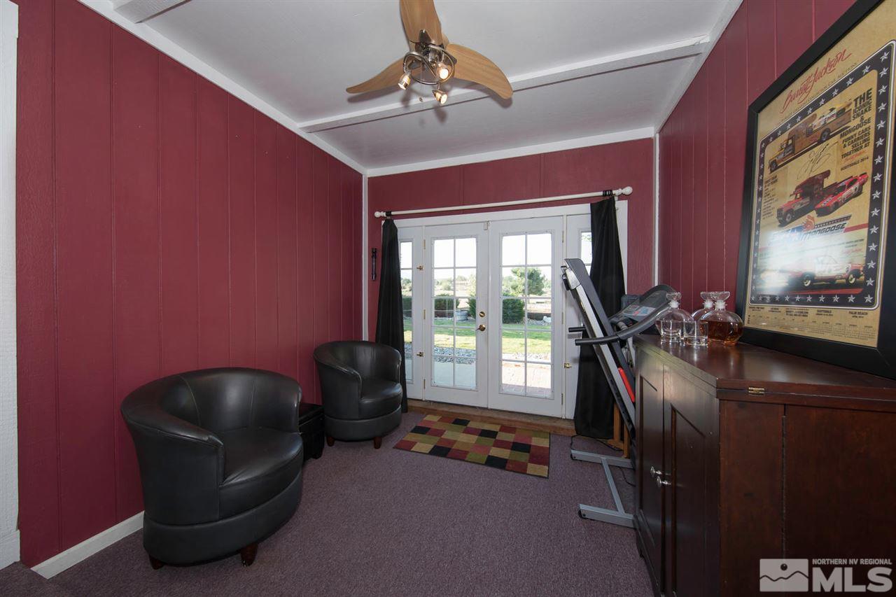 10785 Santa Fe Road Reno, NV 89508 - Photo 8 of 25 a living room with furniture and a floor to ceiling window