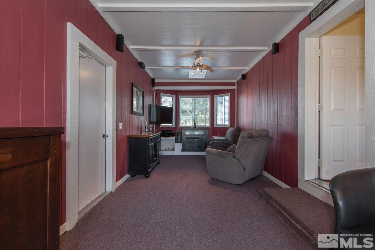 10785 Santa Fe Road Reno, NV 89508 - Photo 9 of 25 a living room with furniture and a window