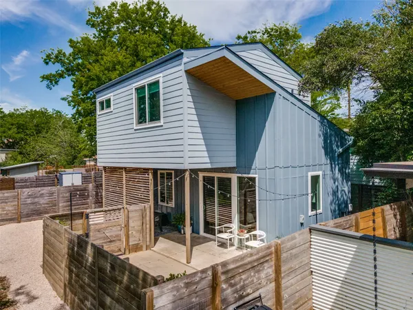 a view of house with outdoor seating area