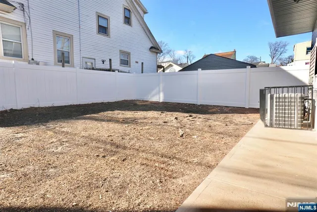 a view of a backyard of the house