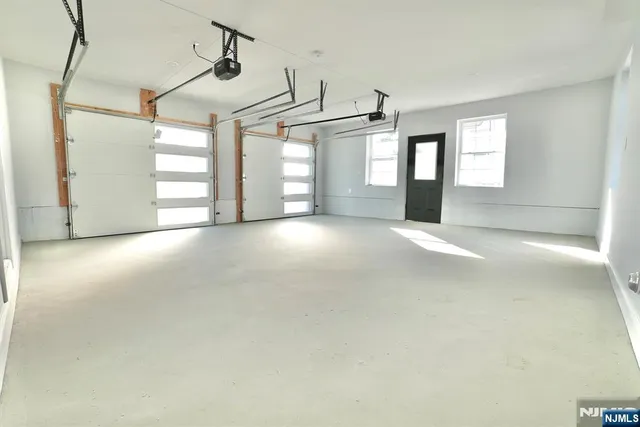 a view of a empty room with windows