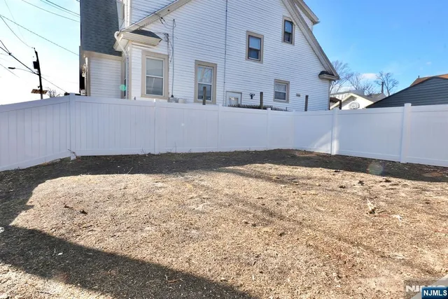 a view of a backyard of the house