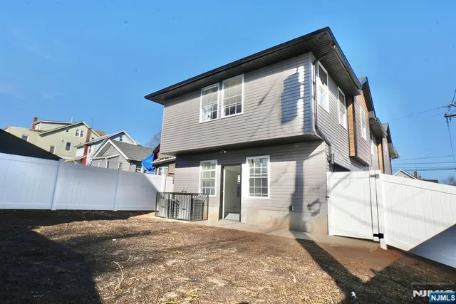 a front view of a house with a garage