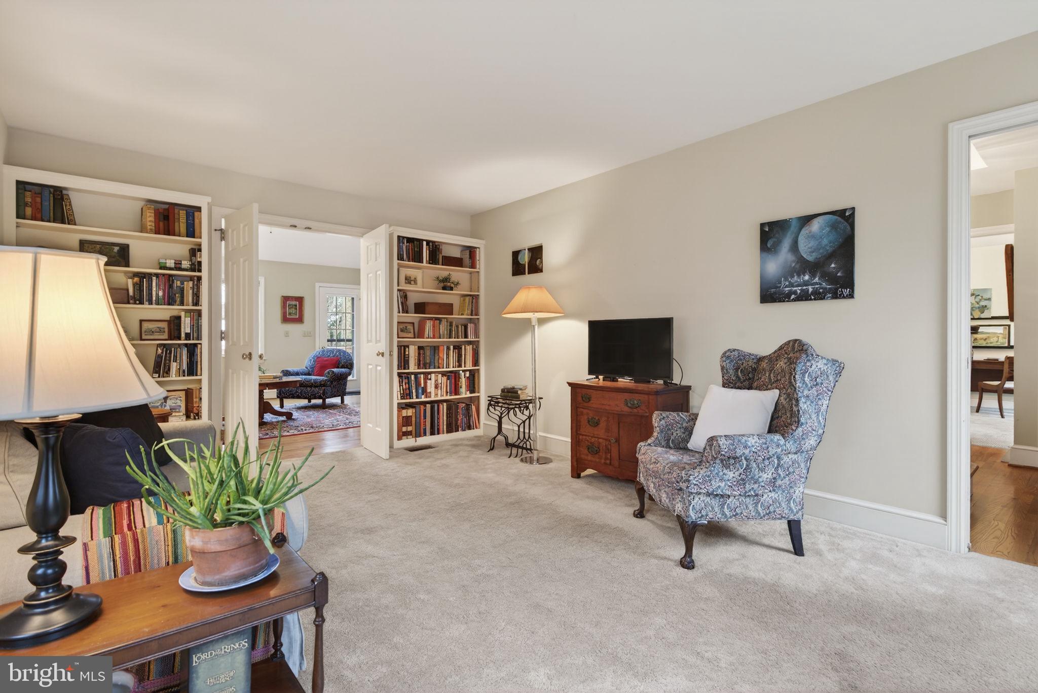 816 Tarpley Drive Lancaster, PA 17601 - Photo 8 of 110 a living room with furniture potted plant a flat screen tv and a window