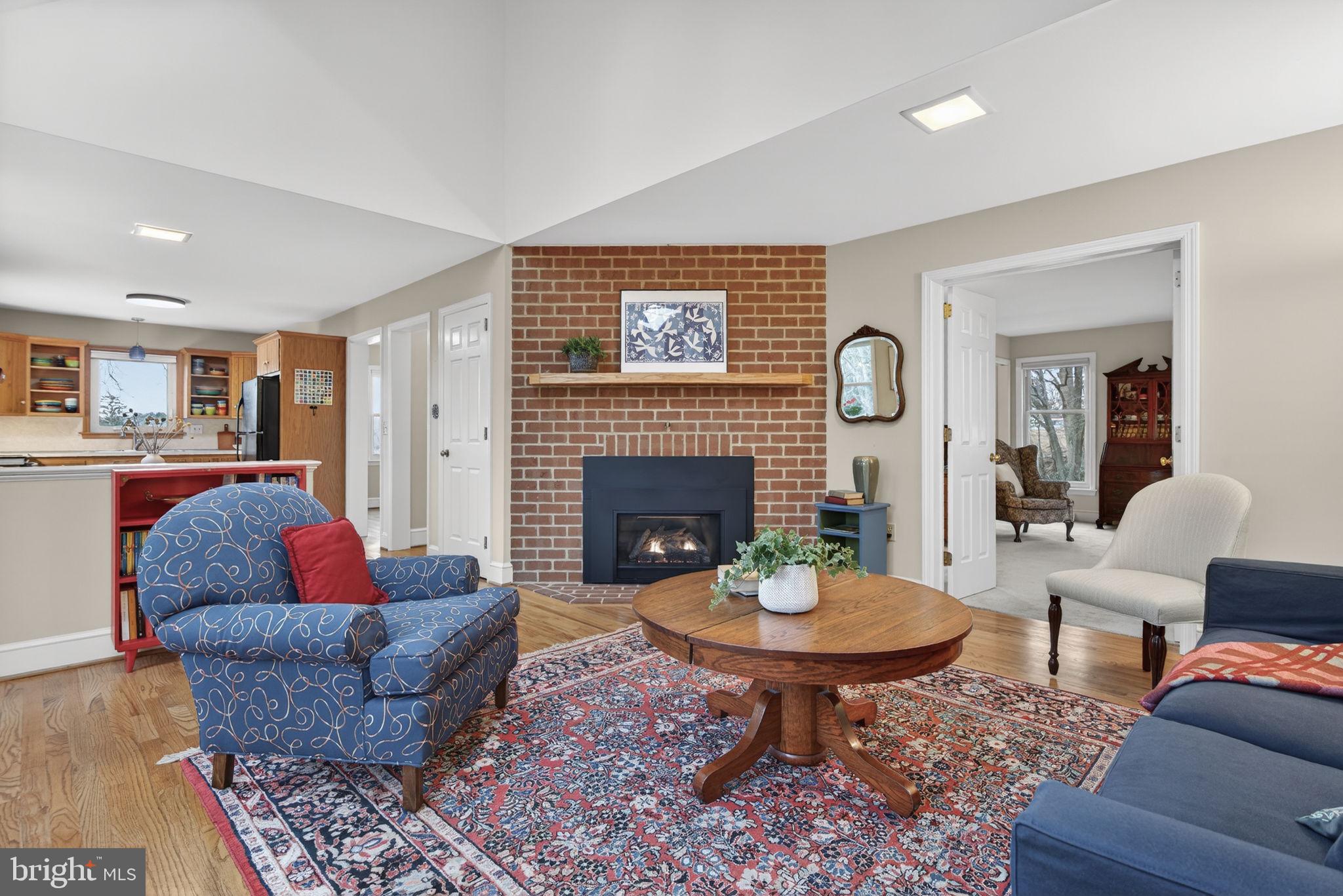 816 Tarpley Drive Lancaster, PA 17601 - Photo 10 of 110 a living room with furniture a table and a fireplace