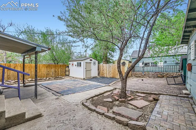 a view of a backyard with a patio