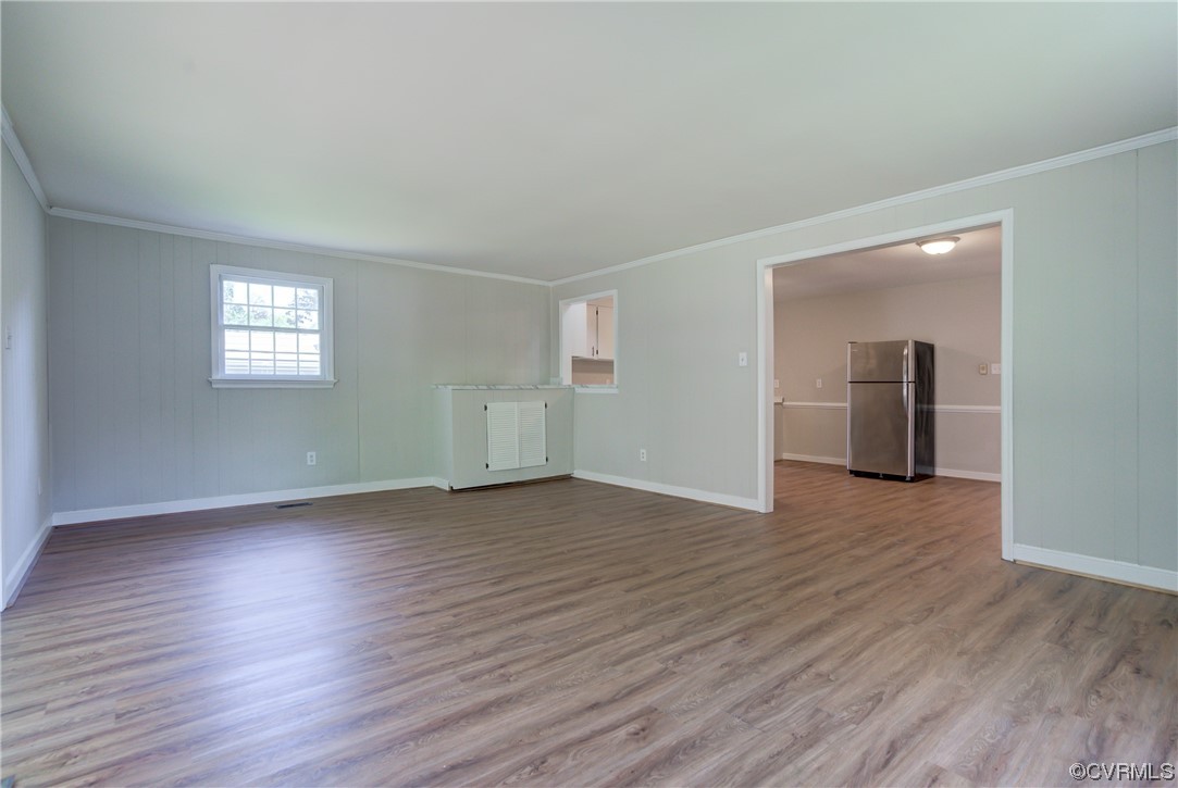 1510 Schloss Road Richmond, VA 23225 - Photo 14 of 28 an empty room with wooden floor and windows