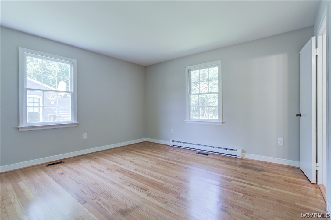 1510 Schloss Road Richmond, VA 23225 - Photo 16 of 28 a view of an empty room with wooden floor and a window