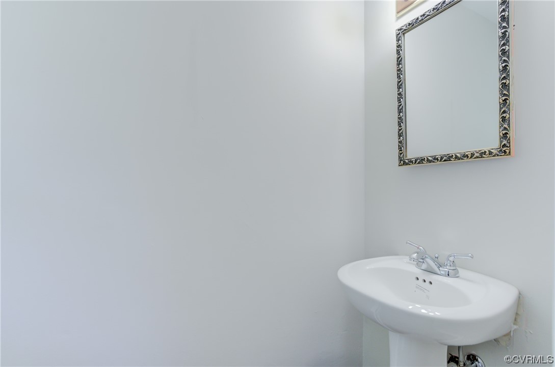 1510 Schloss Road Richmond, VA 23225 - Photo 19 of 28 a bathroom with a sink and a mirror