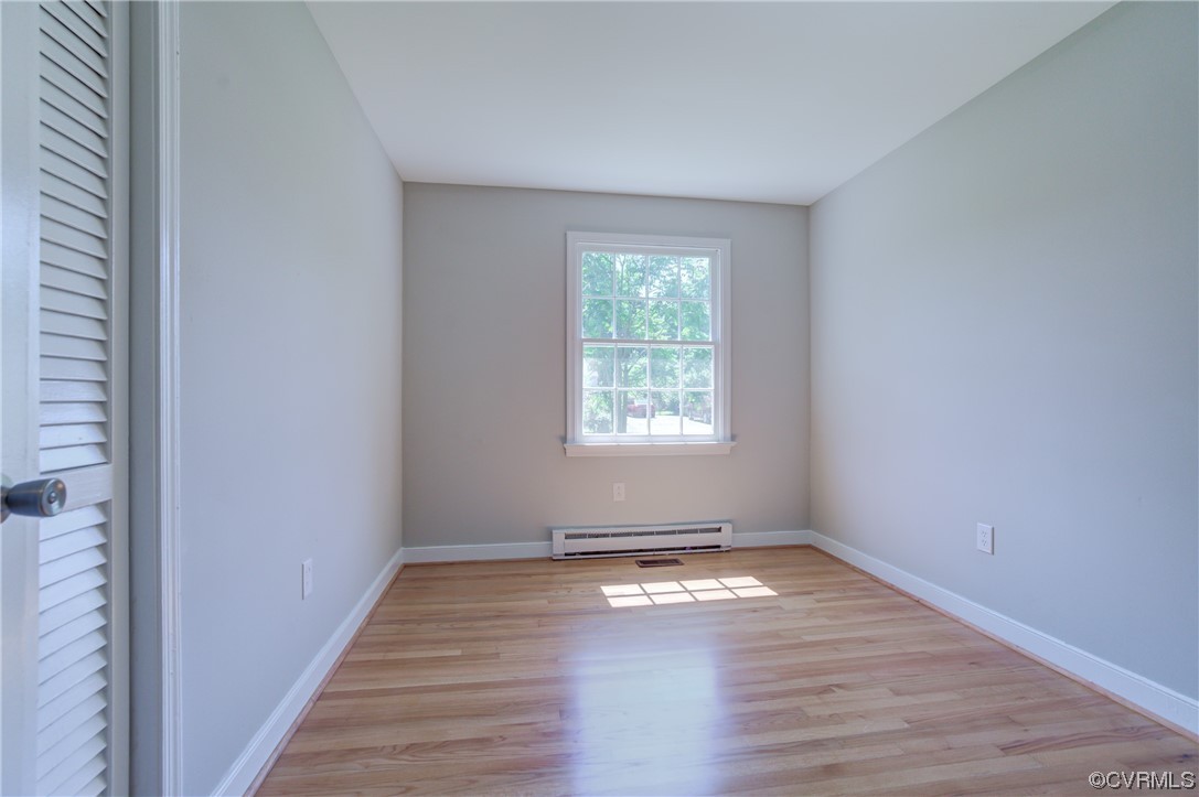 1510 Schloss Road Richmond, VA 23225 - Photo 22 of 28 an empty room with wooden floor and windows