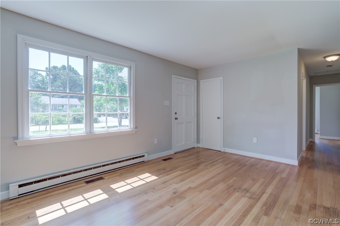 1510 Schloss Road Richmond, VA 23225 - Photo 3 of 28 a view of empty room with wooden floor and fan