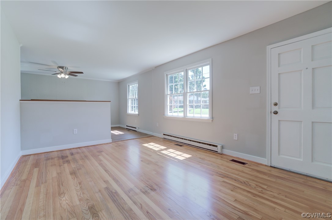 1510 Schloss Road Richmond, VA 23225 - Photo 4 of 28 an empty room with wooden floor and windows