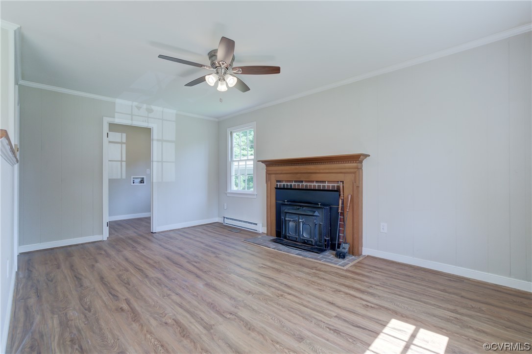 1510 Schloss Road Richmond, VA 23225 - Photo 5 of 28 a view of empty room with wooden floor and fireplace