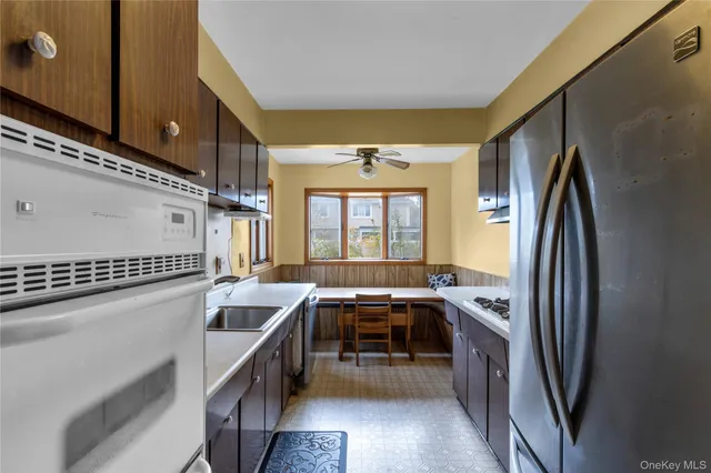 a kitchen with refrigerator and window