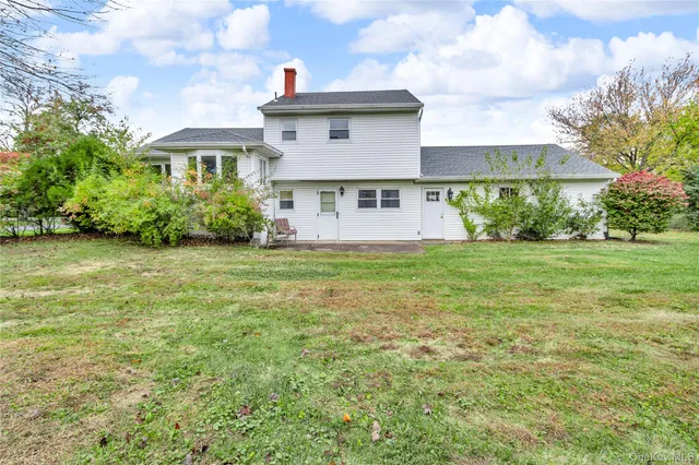 a view of a big yard with an trees