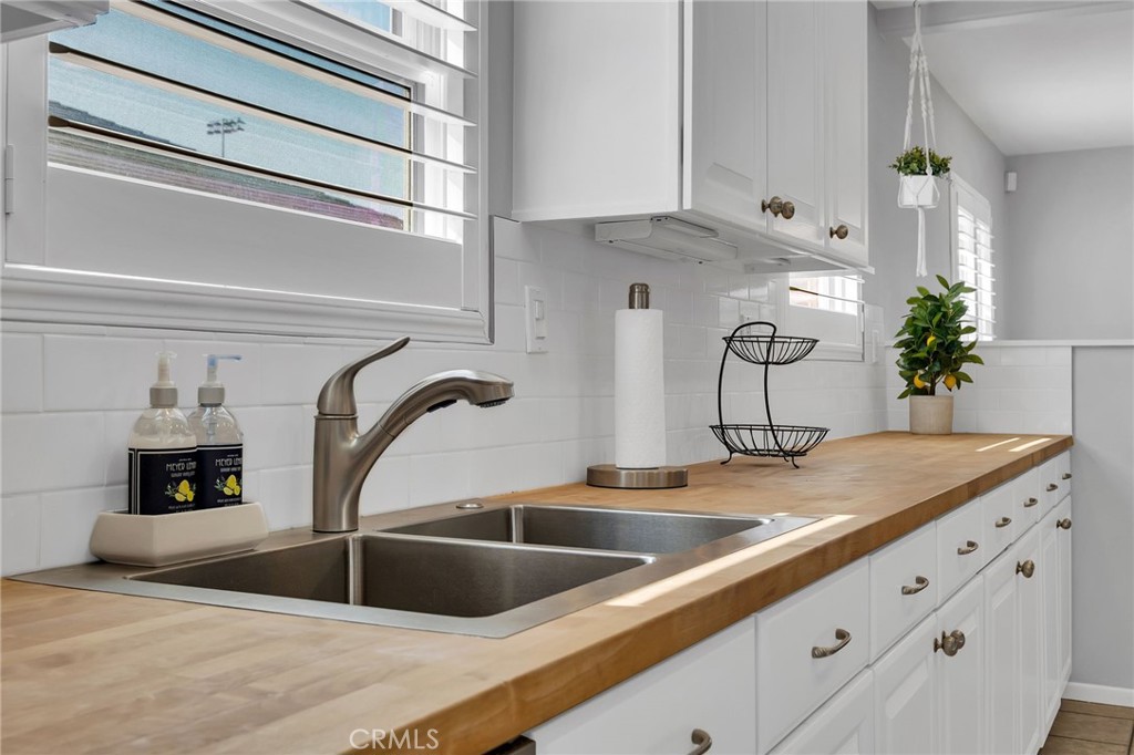 4838 Fidler Avenue Long Beach, CA 90808 - Photo 16 of 56 Stainless Steel Sink, Window & Window Shutter.