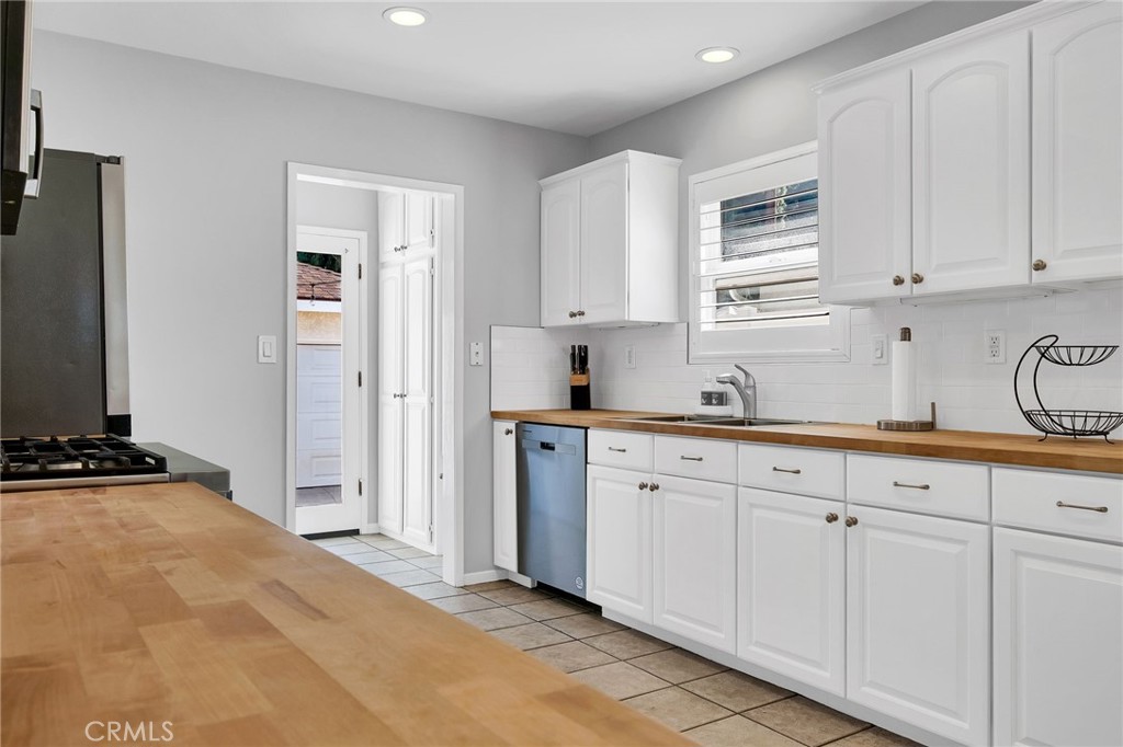 4838 Fidler Avenue Long Beach, CA 90808 - Photo 17 of 56 Plenty of Cabinet Storage, Pantry & Stainless Steel Dishwasher.