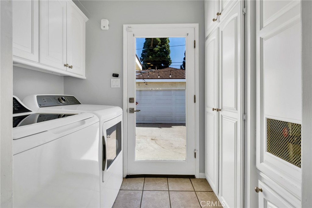 4838 Fidler Avenue Long Beach, CA 90808 - Photo 18 of 56 Interior Laundry Room with Cabinets and Clear Glass Exterior Rear Exit Door.