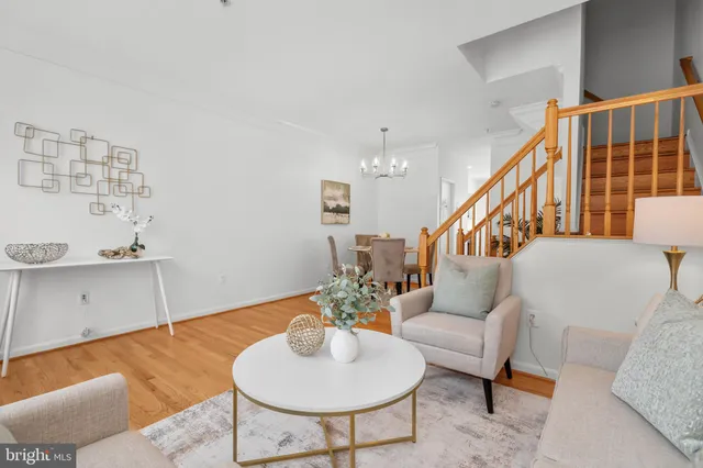 a kitchen with refrigerator cabinets and wooden floor