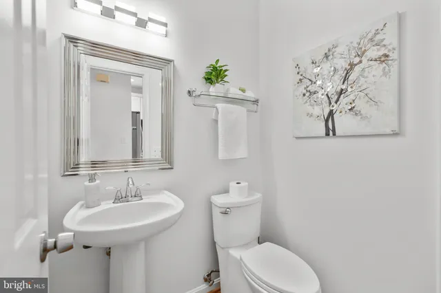 a kitchen with stainless steel appliances a stove a sink and a refrigerator