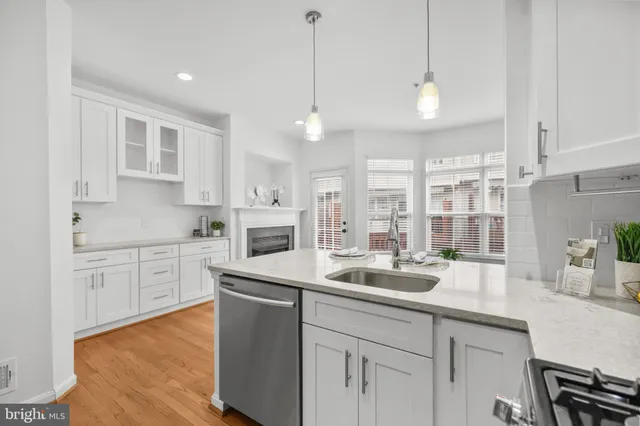 a living room with furniture a dining table and a window