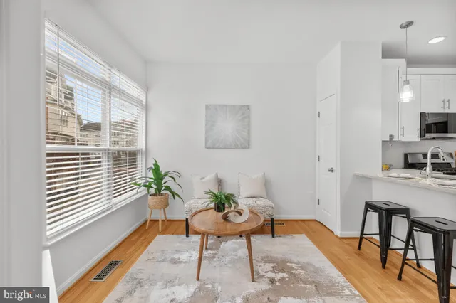 a kitchen with a sink stove and microwave