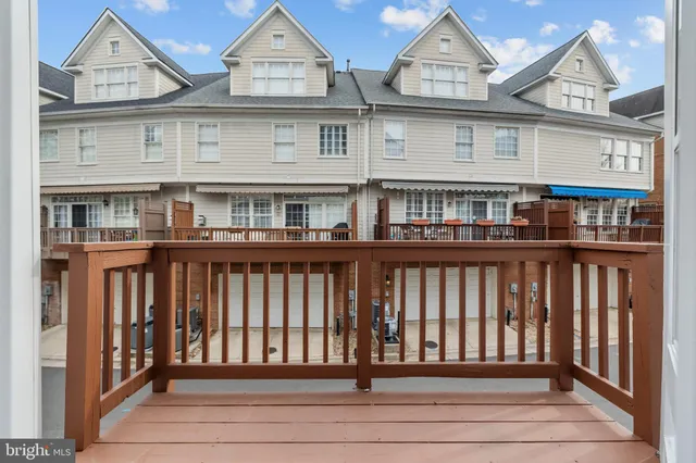 a white bath tub sitting in a bathroom next to a window