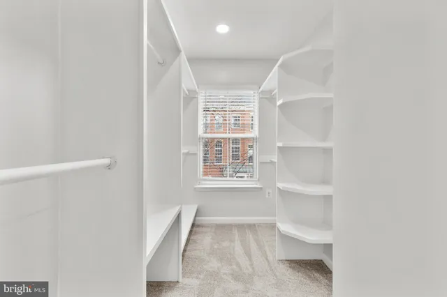 an empty room with a ceiling fan