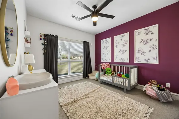 a bed room with furniture and a window