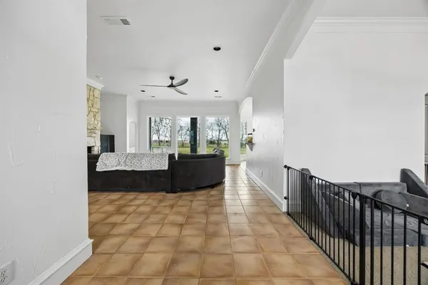a view of a living room with kitchen