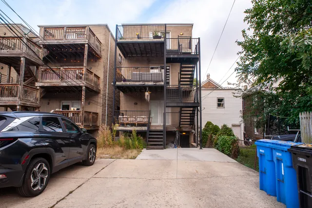 a view of a car park in front of house