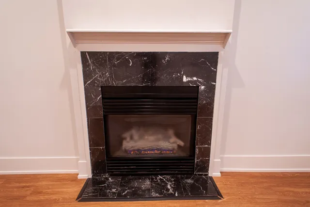 a fireplace with a clock on top