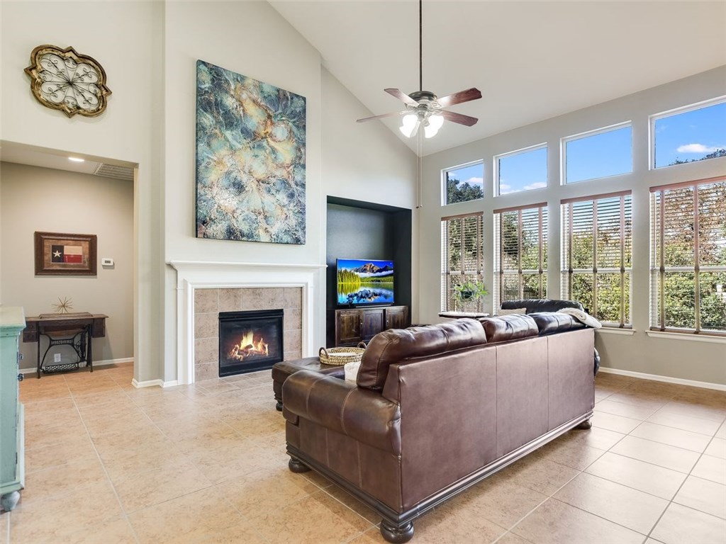 a living room with furniture and a fireplace