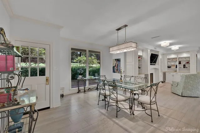 a view of a dining room with furniture window and outside view