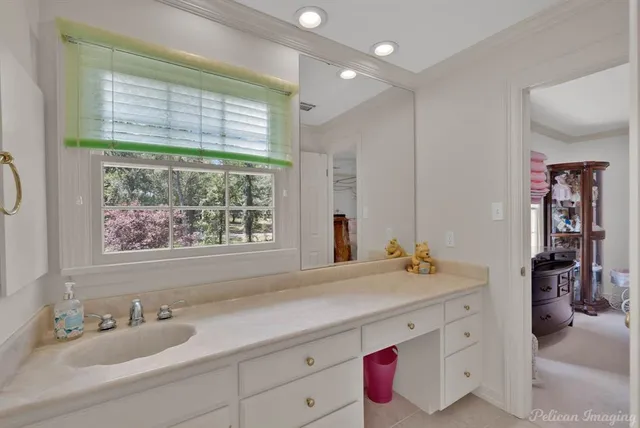 a bathroom with a sink and a large mirror
