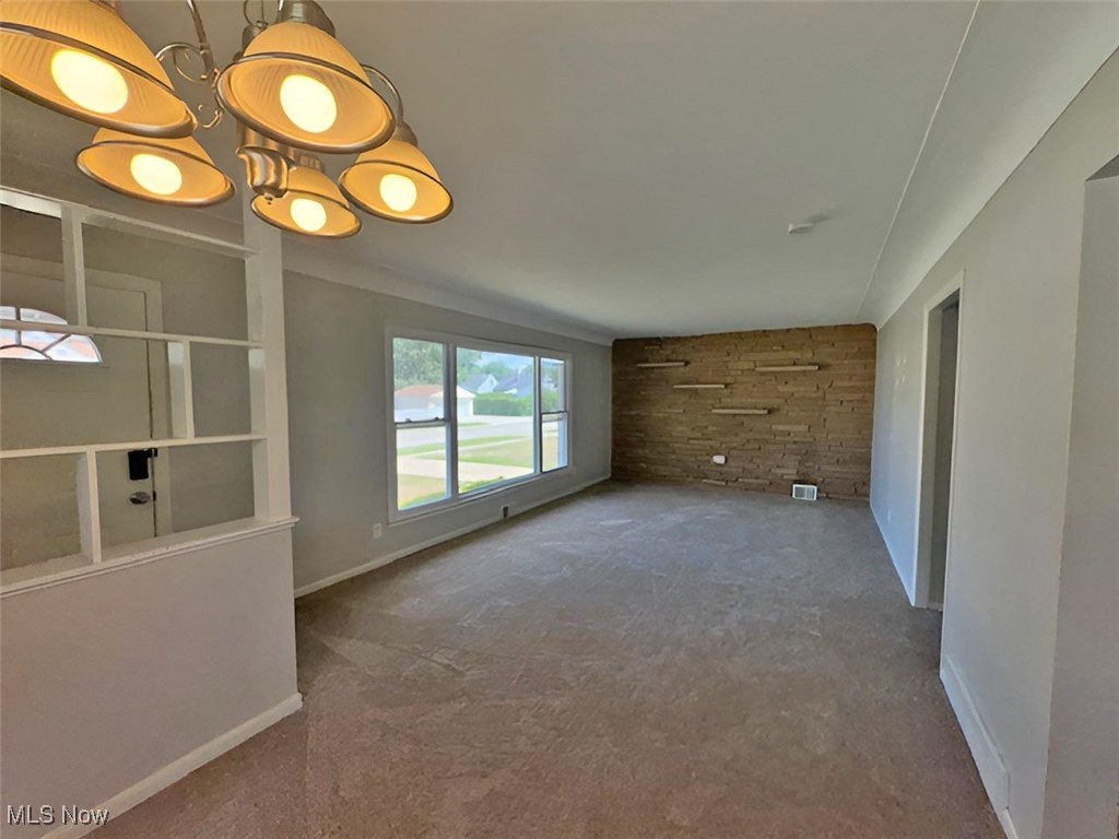 28642 Forest Road Willowick, OH 44095 - Photo 11 of 23 Unfurnished living room featuring carpet floors and baseboards