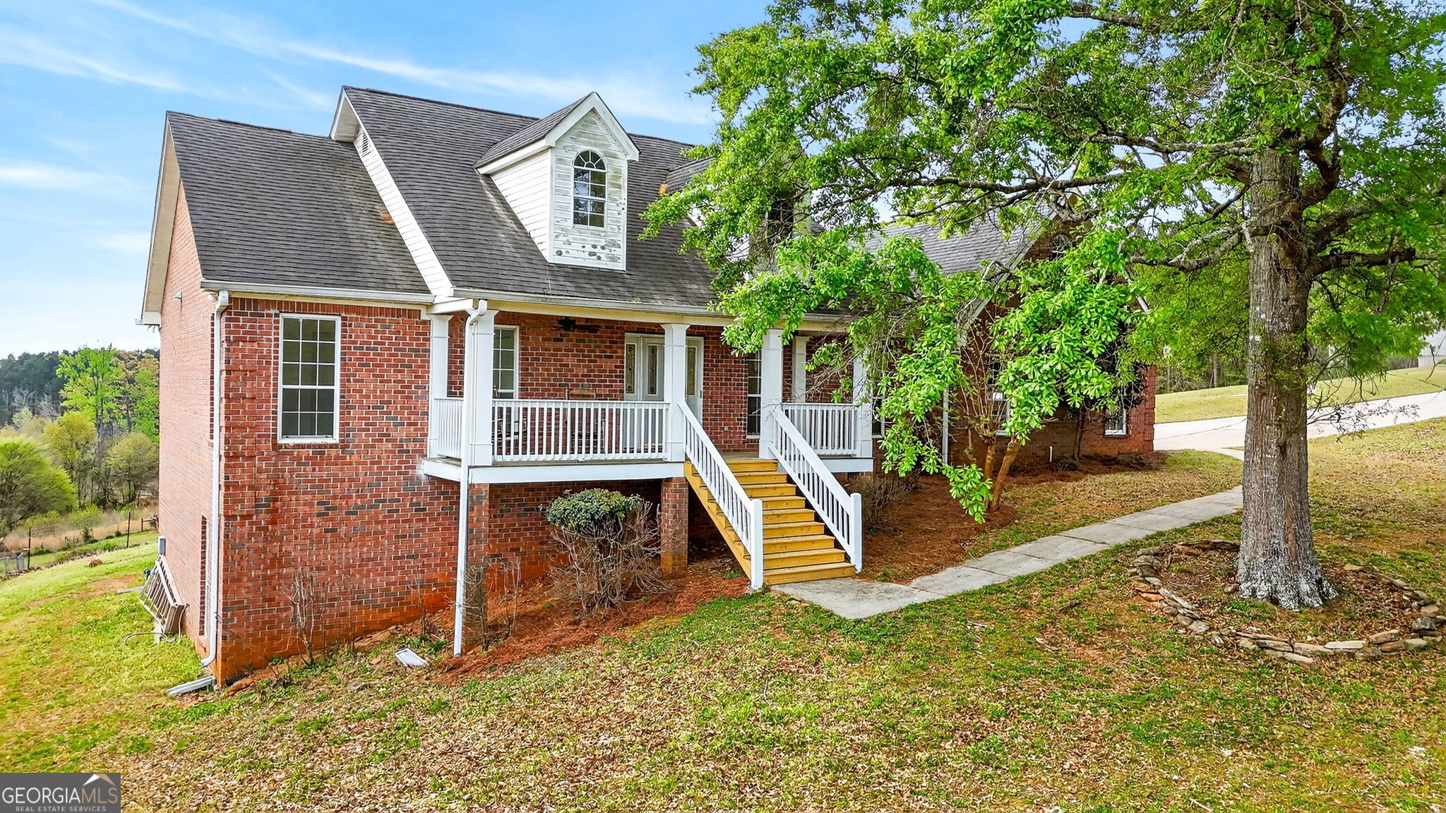 955 Mocassin Gap Road Locust Grove, GA 30248 - Photo 3 of 59 front view of a house with a yard
